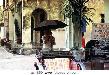 Rickshaw Puller with Umbrella Penang Malaysia Asia View Large Photo Image Stock Photo - Rickshaw Puller with Umbrella Penang Malaysia Asia. Fotosearch