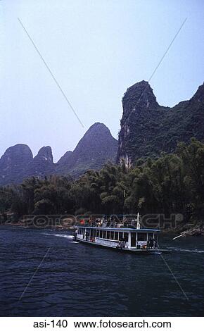 River Boat with Tourists on the Li River Gulin China View Large Photo Image Stock Image - River Boat with Tourists on the Li River Gulin China. Fotosearch