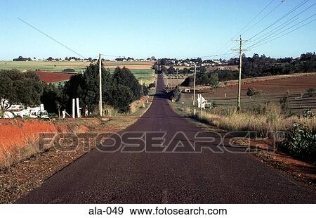 Stock Photo - Road Through Farmland Childers Queensland Australia. Fotosearch