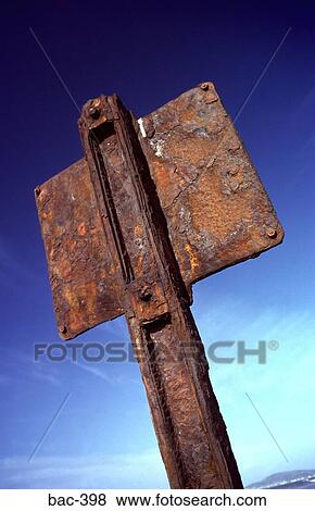 Rusting Back of Iron Sign against Blue Sky View Large Photo Image Stock Photo - Rusting Back of Iron Sign against Blue Sky. Fotosearch