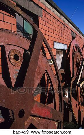 Rusting Metal Wheels View Large Photo Image Stock Photo - Rusting Metal Wheels. Fotosearch