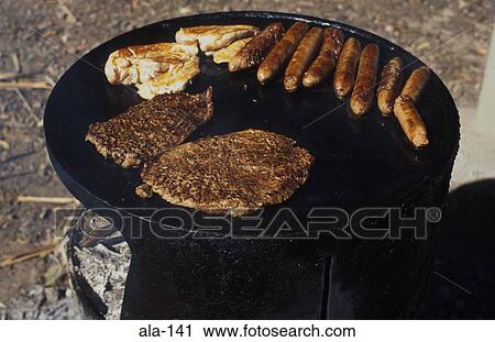 Stock Image - Sausages Pork and Steak on Barbecue. Fotosearch