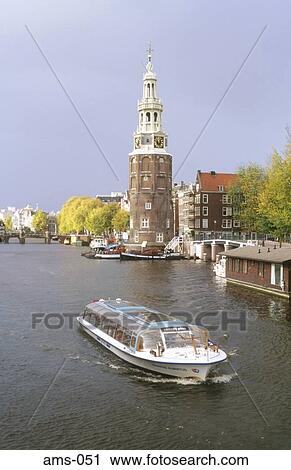 Stock Image - Sightseeing Boat by Montelbaan Tower Amsterdam. Fotosearch