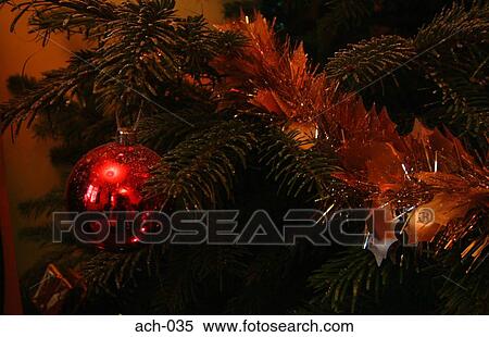 Tinsel and Red Bauble on Christmas Tree View Large Photo Image Stock Photography - Tinsel and Red Bauble on Christmas Tree. Fotosearch