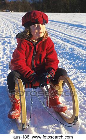 Toddler Sitting on Sledge Austria View Large Photo Image Stock Photograph - Toddler Sitting on Sledge Austria. Fotosearch