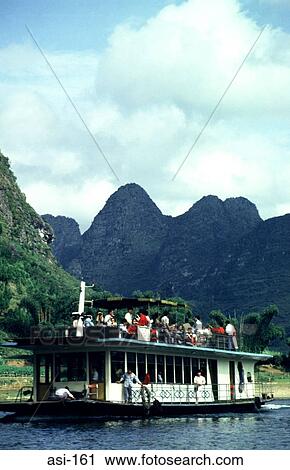 Stock Image - Tourist Boat on River Li. Fotosearch