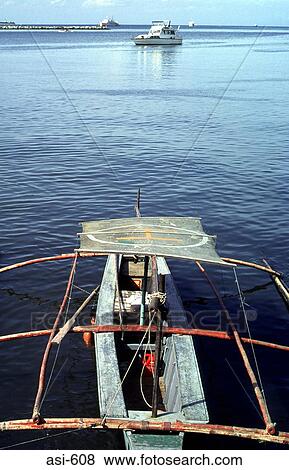 Stock Photo - View of Boats and Manila Bay The Philippines Asia. Fotosearch