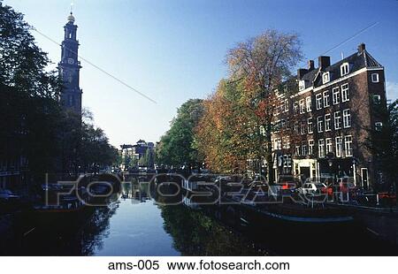 Stock Photography - Westerkirk and Gabled Houses along Canal Amsterdam. Fotosearch