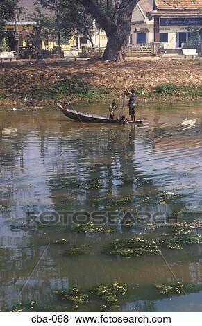 Stock Photo - Boat on the Siem Reap River Cambodia. Fotosearch