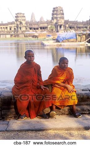 Stock Photo - Boys in Saffron Robes at Angkor Wat Cambodia. Fotosearch