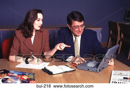 Businessman and Woman in Discussion UK View Large Photo Image Stock Photo - Businessman and Woman in Discussion UK. Fotosearch