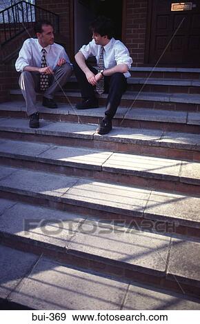 Businessmen Sitting on Steps Talking UK View Large Photo Image Stock Photo - Businessmen Sitting on Steps Talking UK. Fotosearch