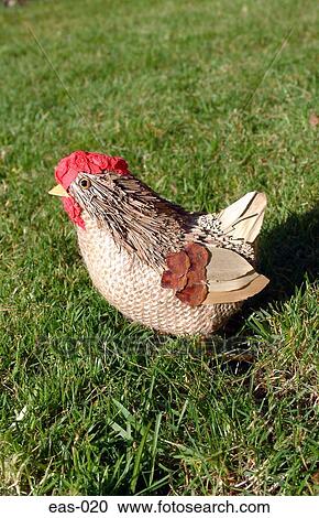 Stock Image - Chicken Ornament on Grass. Fotosearch
