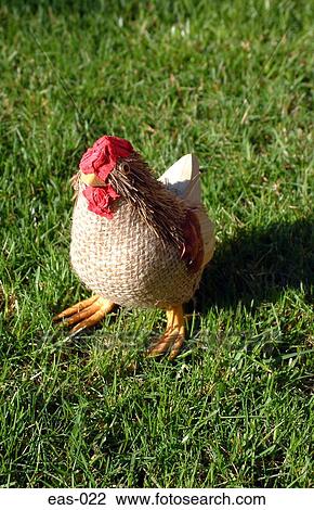 Stock Image - Chicken Ornament on Grass. Fotosearch