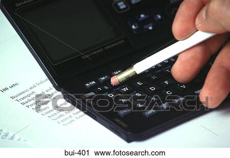 Close-up of Hand using Databank/Calculator View Large Photo Image Stock Image - Close-up of Hand using Databank/Calculator. Fotosearch