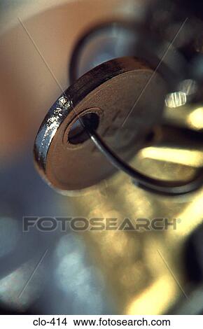 Close Up of Key in Padlock View Large Photo Image Picture - Close Up of Key in Padlock. Fotosearch