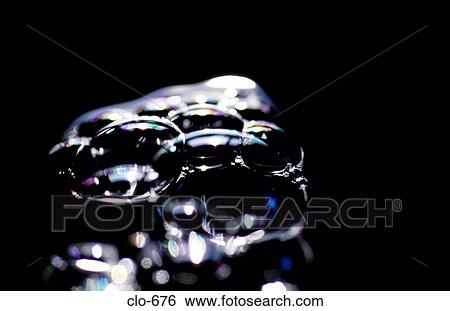 Stock Photograph - Close Up of Light Reflecting off Bubbles. Fotosearch