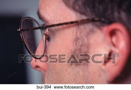 Close-up of Man Looking at a Computer Screen View Large Photo Image Picture - Close-up of Man Looking at a Computer Screen. Fotosearch