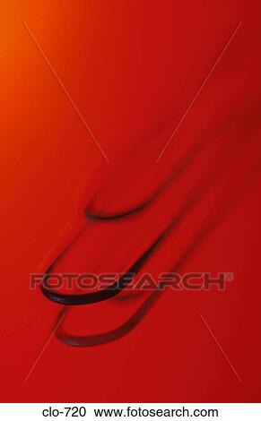Close Up of Paper Clip against Red Background View Large Photo Image Stock Image - Close Up of Paper Clip against Red Background. Fotosearch