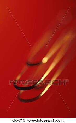 Close Up of Paper Clip against Red Background View Large Photo Image Stock Photography - Close Up of Paper Clip against Red Background. Fotosearch
