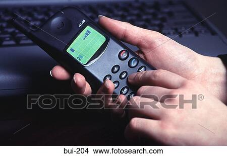 Close-up of Woman's Hands Holding a Mobile Phone View Large Photo Image Picture - Close-up of Woman's Hands Holding a Mobile Phone. Fotosearch