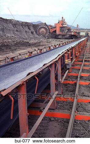 Stock Photo - Conveyor Belt and Excavator in an Coal Mine Thailand. Fotosearch