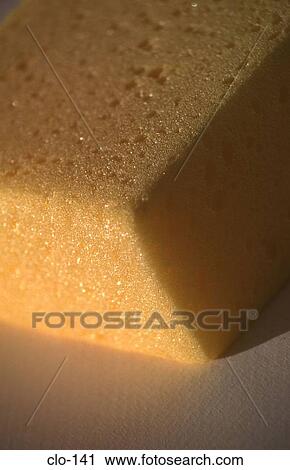 Stock Image - Corner of Yellow Cleaning Sponge. Fotosearch
