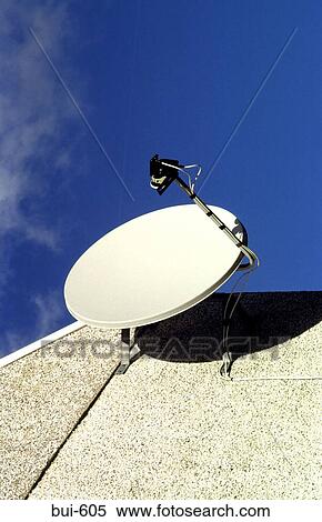 Stock Photography - Domestic Satellite Dish Against a Blue Sky. Fotosearch