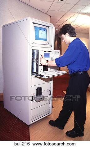 Engineer at Network Server UK View Large Photo Image Stock Photograph - Engineer at Network Server UK. Fotosearch