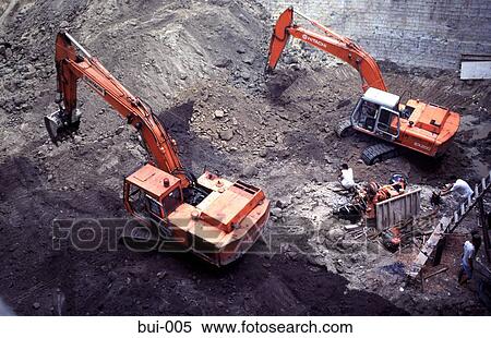Excavators working on foundations View Large Photo Image Stock Photography - Excavators working on foundations. Fotosearch