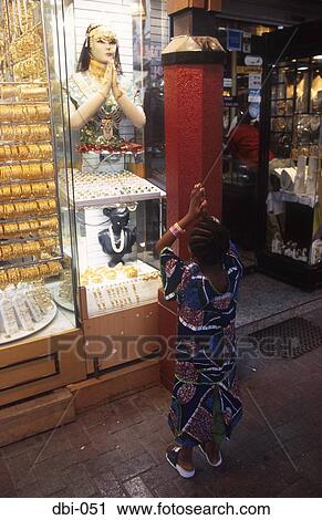 Stock Image - Figure in Shop Window Dubai UAE. Fotosearch