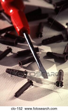 Stock Image - Flat Bladed Screwdriver and Rawlplugs. Fotosearch
