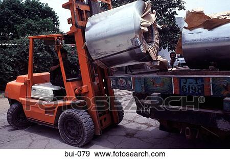 Fork Lift Truck Carrying a Roll of Sheet Metal View Large Photo Image Stock Photo - Fork Lift Truck Carrying a Roll of Sheet Metal. Fotosearch