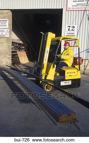 Fork Lift Truck Carrying Angle Iron UK View Large Photo Image Stock Photograph - Fork Lift Truck Carrying Angle Iron UK. Fotosearch