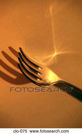 Fork on a Yellow Background View Large Photo Image Stock Photography - Fork on a Yellow Background. Fotosearch