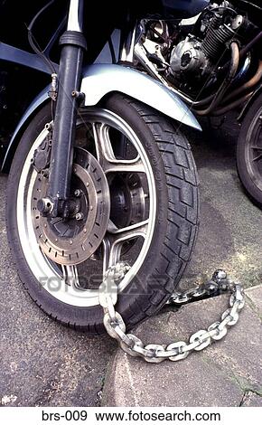 Front Wheel Motorcycle Chained Up UK View Large Photo Image Stock Photo - Front Wheel Motorcycle Chained Up UK. Fotosearch