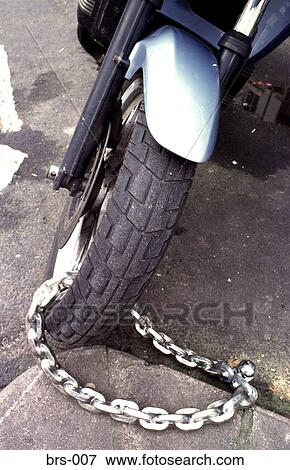 Front Wheel of Motorcycle Chained Up UK View Large Photo Image Stock Photo - Front Wheel of Motorcycle Chained Up UK. Fotosearch