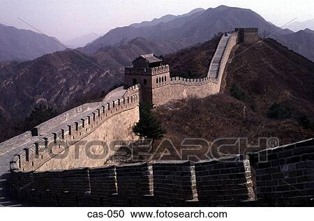 Stock Image - Great Wall of China Snaking Over Hill Badaling China. Fotosearch