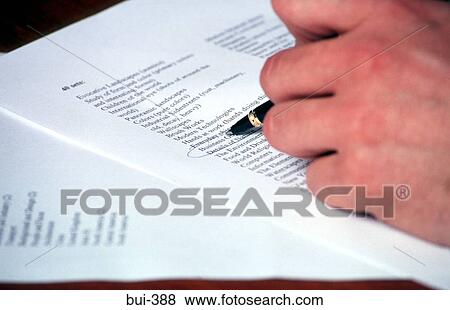 Stock Photo - Hand Circling Item on List. Fotosearch