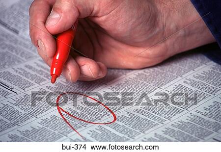 Hand Circling Newspaper Advertisement View Large Photo Image Picture - Hand Circling Newspaper Advertisement. Fotosearch