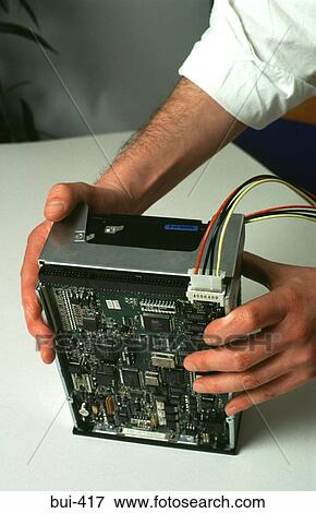 Hands Manipulating Computer Component View Large Photo Image Stock Photo - Hands Manipulating Computer Component. Fotosearch