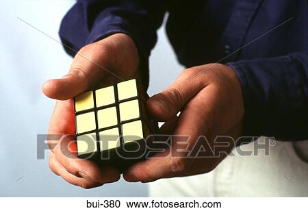 Hands of Man Playing With Rubik's Cube View Large Photo Image Stock Image - Hands of Man Playing With Rubik's Cube. Fotosearch