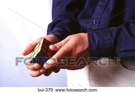 Hands of Man Playing With Rubik's Cube View Large Photo Image Stock Photo - Hands of Man Playing With Rubik's Cube. Fotosearch