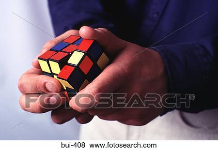 Hands using Rubik's Cube View Large Photo Image Stock Photo - Hands using Rubik's Cube. Fotosearch