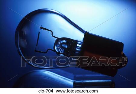 Light Bulb against Blue Background View Large Photo Image Picture - Light Bulb against Blue Background. Fotosearch