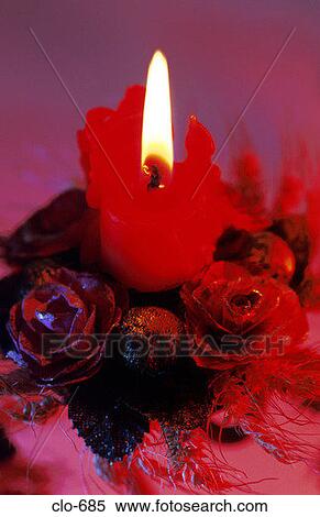 Lit Candle on Christmas Centre-Piece View Large Photo Image Stock Photography - Lit Candle on Christmas Centre-Piece. Fotosearch