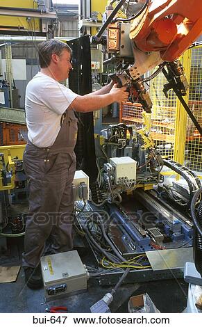 Man Checking Robotic Arm View Large Photo Image Stock Photo - Man Checking Robotic Arm. Fotosearch