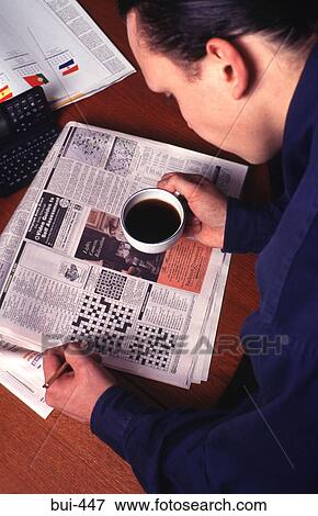 Man Doing Newspaper Crossword View Large Photo Image Stock Photo - Man Doing Newspaper Crossword. Fotosearch