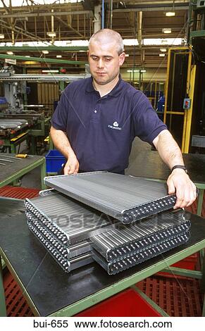 Man Handling Radiators in Car Manufacturing Plant View Large Photo Image Stock Photography - Man Handling Radiators in Car Manufacturing Plant. Fotosearch