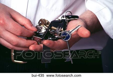 Man Looking through Bunch of Keys View Large Photo Image Stock Photography - Man Looking through Bunch of Keys. Fotosearch